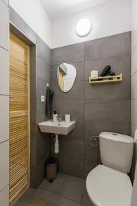 a bathroom with a toilet and a sink at Best View Apartments in Bratislava