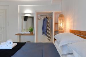Postel nebo postele na pokoji v ubytování Ammos Luxury Rooms & Home