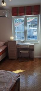 Postel nebo postele na pokoji v ubytování DLX Apartman Adriatics