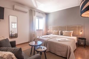 Ένα ή περισσότερα κρεβάτια σε δωμάτιο στο Virginia Guest House