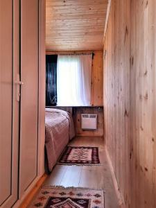 Postel nebo postele na pokoji v ubytování Tiny House Kazbegi