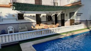 a house with a swimming pool next to a building at Villa Gení La Victoria by Ruralidays in La Victoria