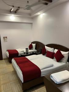 Postel nebo postele na pokoji v ubytování Hotel Sun International