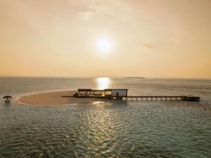 a small island in the middle of the ocean at Alila Kothaifaru Maldives 