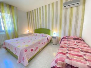 Postel nebo postele na pokoji v ubytování Venere Apartament