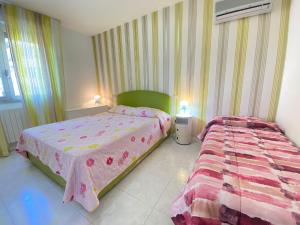 Postel nebo postele na pokoji v ubytování Venere Apartament