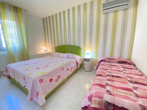 Postel nebo postele na pokoji v ubytování Venere Apartament