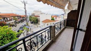 a balcony with a view of a city street at Fani apartment in Ouranoupoli