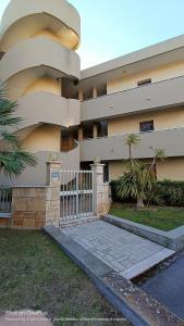 a building with a gate in front of it at Casa al mare Santo Stefano al Mare in Santo Stefano al Mare