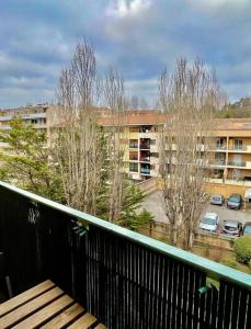 a balcony with a view of a parking lot at Studio Sainte Victoire avec balcon in Aix-en-Provence