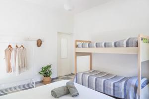 a bedroom with two bunk beds and a closet at ~ ~ Brezza Mediterranea ~ ~ in Ponza
