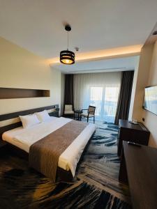 Postel nebo postele na pokoji v ubytování Hotel Scapino