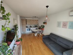 a living room with a couch and a table at Lucy Apartment Split in Split +9 photos