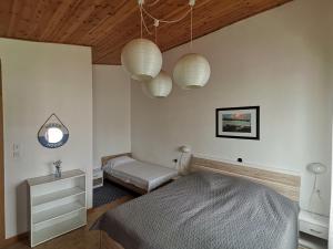 a bedroom with two beds and two lights at Apartment Studio Zvonka in Zambratija