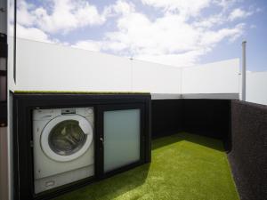 a washing machine sitting on top of a building at Edison Penthouse By CanariasGetaway in Las Palmas de Gran Canaria