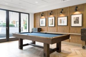 a pool table in a room with wooden walls at Redwood City 1BR w Roof Gym WD nr Caltrain SFO-959 in Redwood City