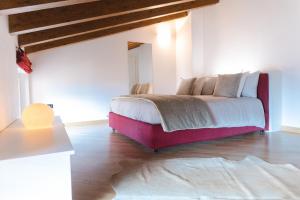 A bed or beds in a room at Casa Celeste