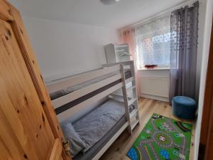 Katil atau katil-katil dalam bilik di Ferienwohnung Nordseemond