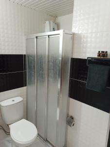 a bathroom with a toilet and a shower at Konyaaltı Tunç Apart in Antalya