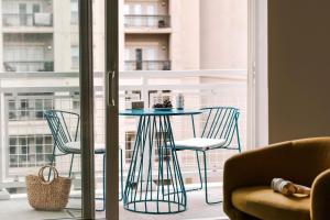 a table and chairs in front of a window at Sonder Midtown South in Atlanta