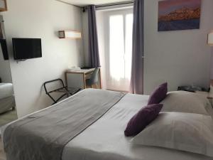Postel nebo postele na pokoji v ubytování Fifi Moulin