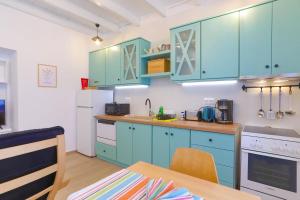 A kitchen or kitchenette at Kaminaki Beachfront Apartments