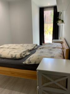 Posteľ alebo postele v izbe v ubytovaní Jerry Apartman