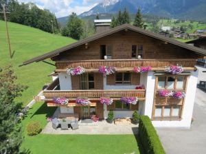 an aerial view of a house with flowers at Haus Stegen in Maria Alm am Steinernen Meer