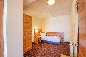 Postel nebo postele na pokoji v ubytování Ferien Hotel Rennsteigblick