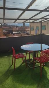 two chairs and a table on a roof at Zona Pedonale - RoughLuxe Home in Arezzo