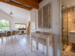 a kitchen and dining room with a sink and a glass shower at Holiday Home Golf Loisirs-4 by Interhome in Lacanau-Océan +29 photos