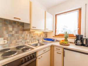 A kitchen or kitchenette at Apartment Apart Romantica - KPL213 by Interhome