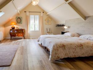 un dormitorio en el ático con 2 camas y un piano en Holiday Home La Forge de Marcel - FTH400 by Interhome, en Fontaine-Henry