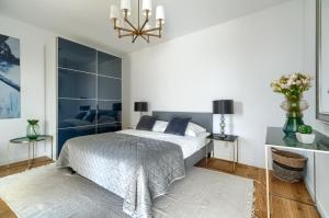 Ένα ή περισσότερα κρεβάτια σε δωμάτιο στο Przy Plaży - City Apartments