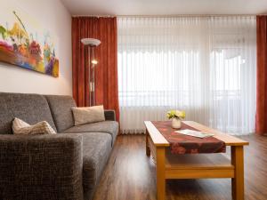 a living room with a couch and a coffee table at Apartment A707 by Interhome in Lahnstein