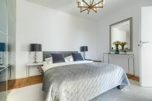 En eller flere senge i et værelse på Przy Plaży - City Apartments