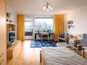 a living room with a bed and a table at Apartment B609 by Interhome in Lahnstein