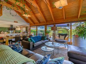 a living room with leather couches and tables at Holiday Home Blue Moustoir by Interhome in Carnac