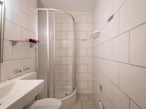 a bathroom with a shower and a toilet and a sink at Apartment B905 by Interhome in Lahnstein