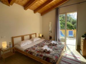 a bedroom with a bed with towels on it at Apartment Adriana - PRE170 by Interhome in Valloria