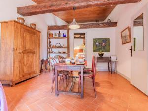 a kitchen and dining room with a table and chairs at Holiday Home L'Amandier - ORN310 by Interhome in Oraison