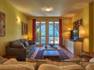 A seating area at Apartment Poggio degli Ulivi by Interhome