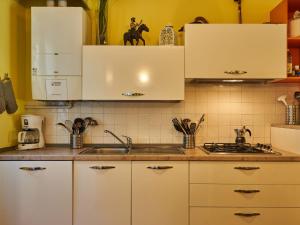 A kitchen or kitchenette at Apartment Poggio degli Ulivi by Interhome