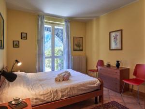 A bed or beds in a room at Apartment Poggio degli Ulivi by Interhome