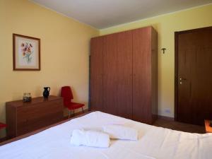 A bed or beds in a room at Apartment Poggio degli Ulivi by Interhome