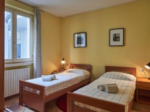 A bed or beds in a room at Apartment Poggio degli Ulivi by Interhome