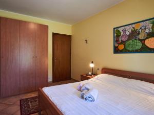 A bed or beds in a room at Apartment Poggio degli Ulivi by Interhome