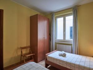 A bed or beds in a room at Apartment Poggio degli Ulivi by Interhome