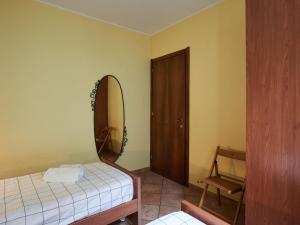 A bed or beds in a room at Apartment Poggio degli Ulivi by Interhome