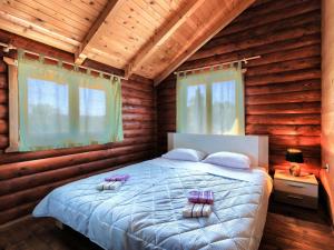 Postel nebo postele na pokoji v ubytování Holiday Home Minja by Interhome